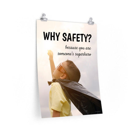 A workplace safety poster showing a young child with a makeshift cape and mask striking a superhero pose with the slogan why safety? because you are someone's superhero.