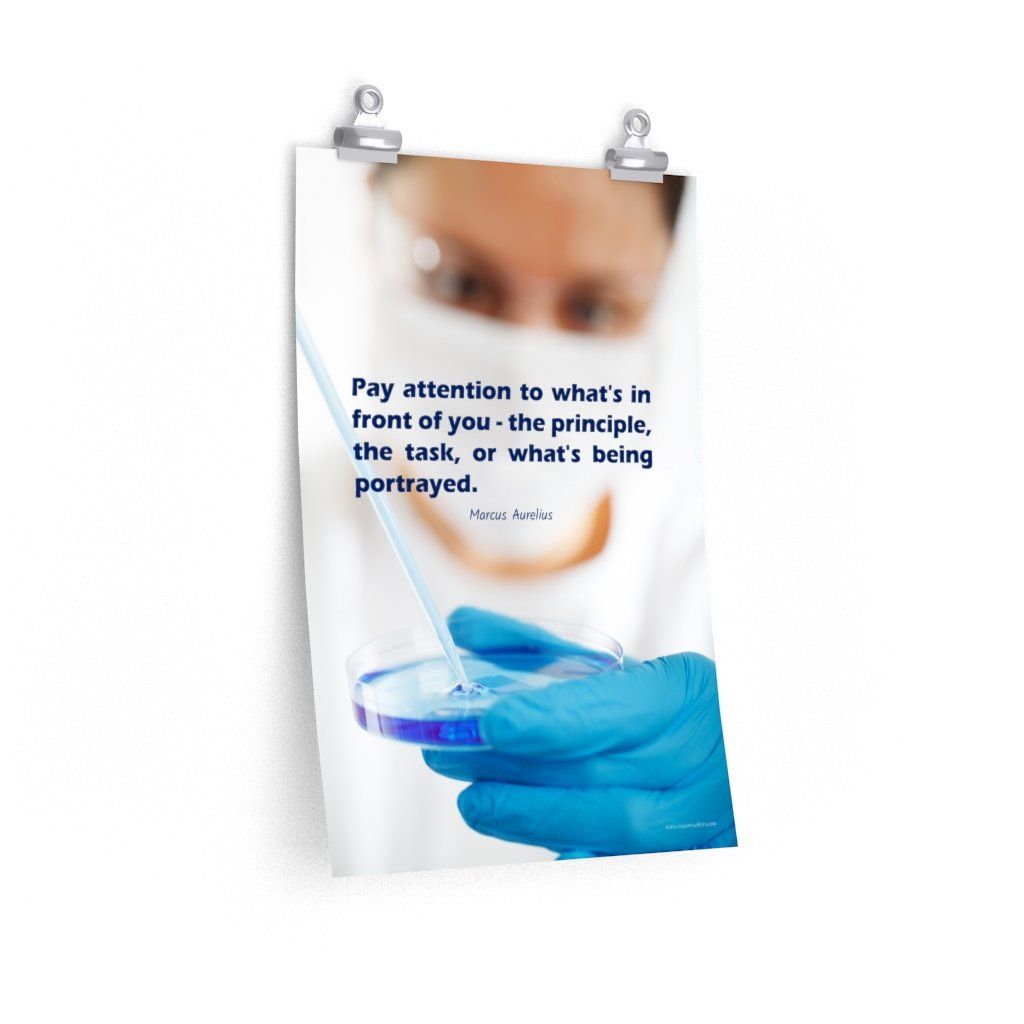 Safety poster showing a close up of a woman's face wearing safety glasses and a white face mask, holding a petri dish and pipette with a safety quote written in blue text.