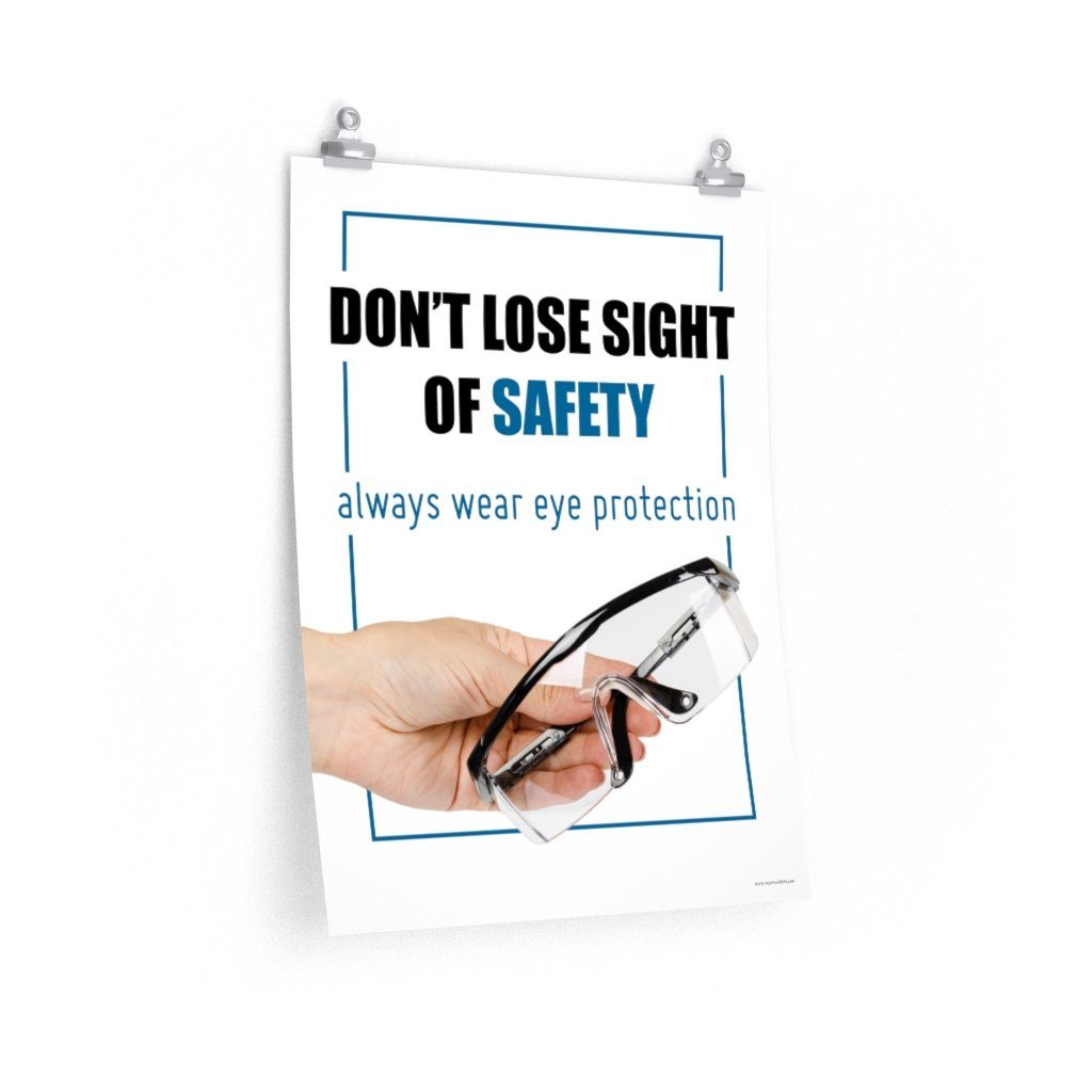 An eye safety slogan showing a close up of a hand presenting out safety glasses with a safety slogan in blue text above.