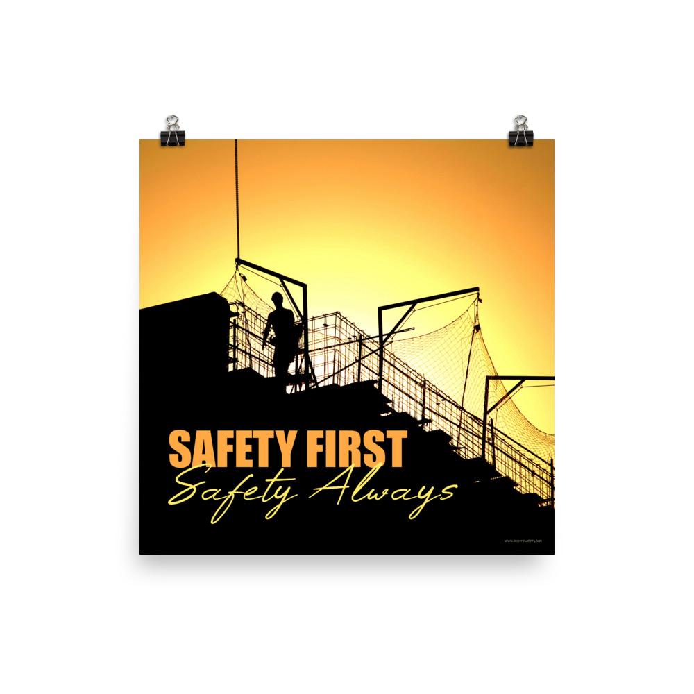 A workplace safety poster showing a construction site and construction workers being silhouetted by a bright and beautiful sunset of different shades of orange with the slogan safety first, safety always.