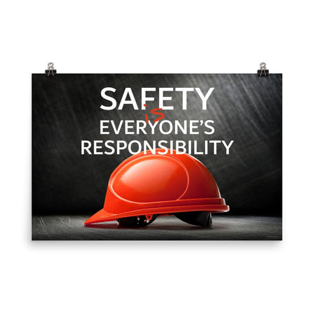 A workplace safety poster showing a red hard hat in front of a grey, industrial-looking background with the slogan safety is everyone's responsibility.