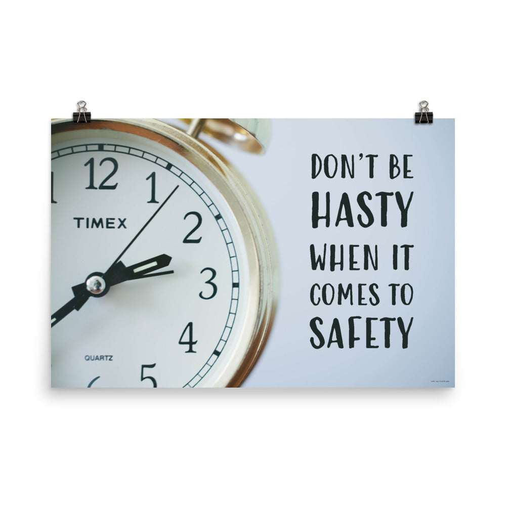 A workplace safety poster showing a close-up of a clock face with the slogan don't be hasty when it comes to safety.