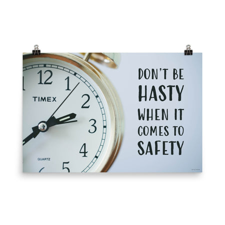 A workplace safety poster showing a close-up of a clock face with the slogan don't be hasty when it comes to safety.