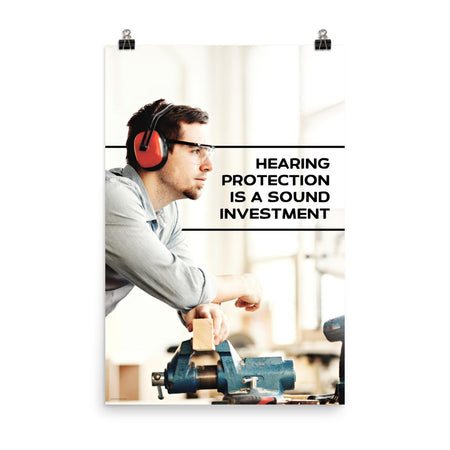 A workplace safety poster of a man in safety glasses and earmuffs taking a break in his woodshop with a safety slogan to the right.