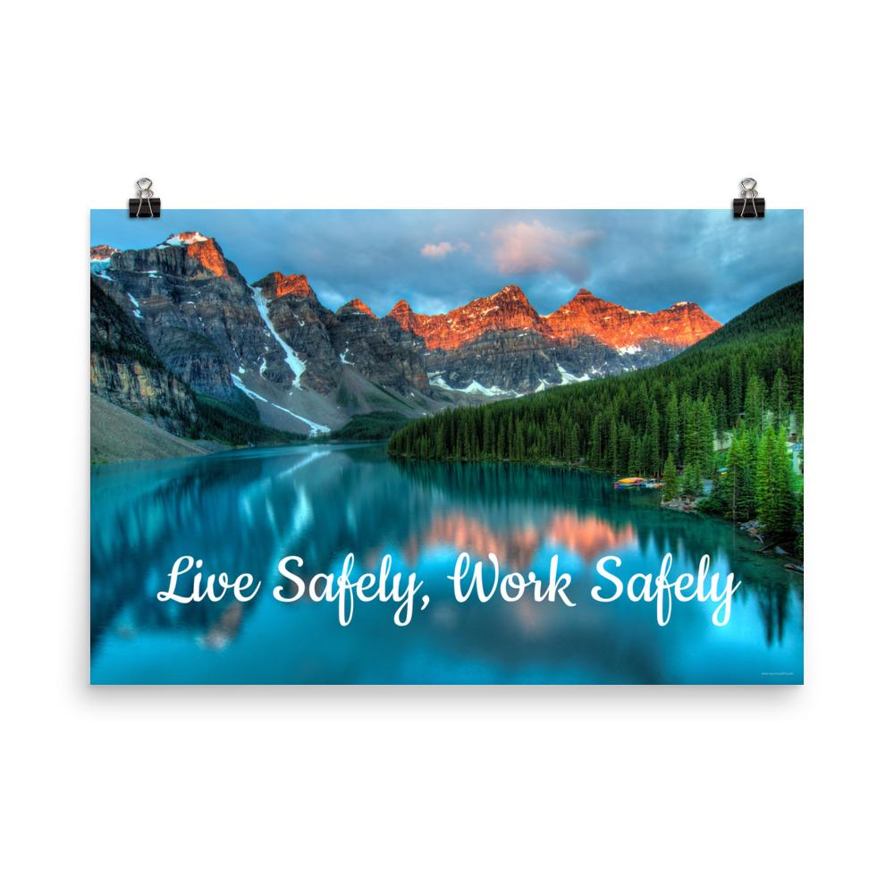 A workplace safety poster depicting a beautiful landscape of mountains with a river flowing down the side of the mountains into a bright blue pond with text saying live safely work safely.