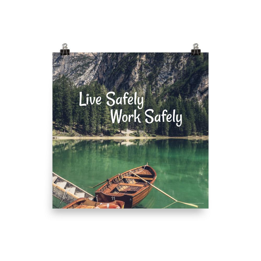 A workplace safety poster depicting a beautiful landscape of mountains in the background of a lake with a little wooden boat in the lake with text saying live safely work safely.