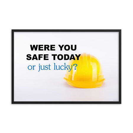A workplace safety poster showing a yellow hard hat on a plain white background with the slogan were you safe today, or just lucky?
