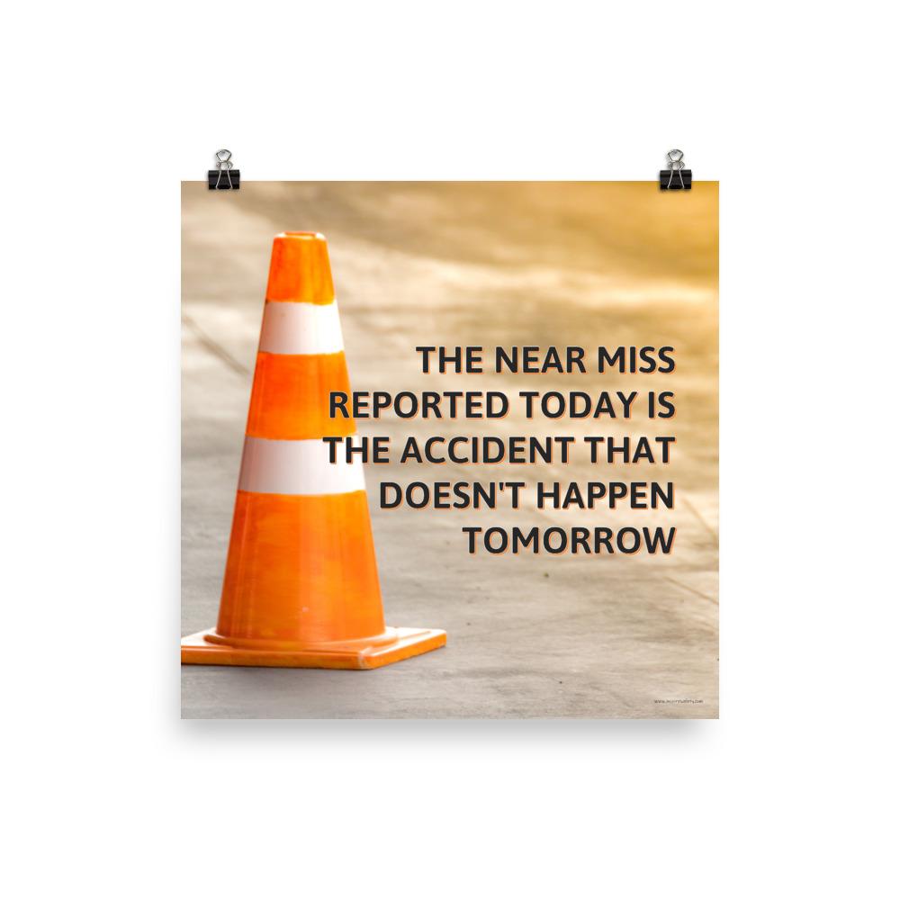 A workplace safety poster showing an orange safety cone with the slogan the near miss reported today is the accident that doesn't happen tomorrow.