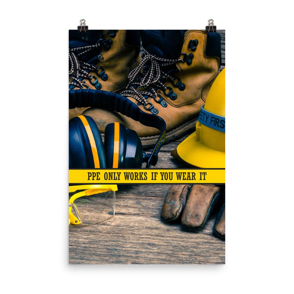 A safety poster showing a close-up of various PPE including safety glasses, ear muffs, gloves, a hard hat, and work boots with the slogan PPE only works if you wear it.