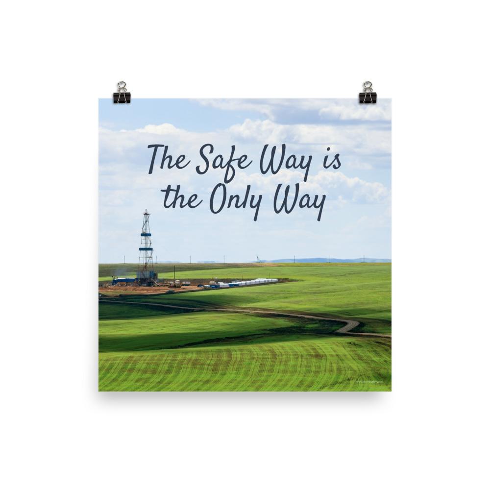 A safety poster showing an oil rig in a beautiful landscape scene of a field with vivid green grass and a bright blue sky with the slogan the safe way is the only way.
