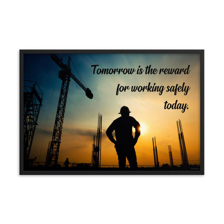 A safety poster showing a worker on a construction site being silhouetted by a sunset of orange and blue colors with the slogan tomorrow is the reward for working safely today.