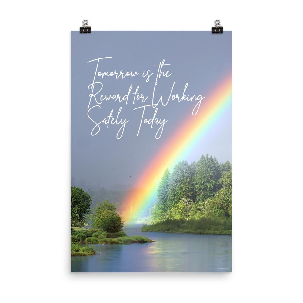 A workplace safety poster showing bright forest scene with a lake and vibrant green trees and a colorful rainbow coming out of the forest with the slogan tomorrow is the reward for working safely today.