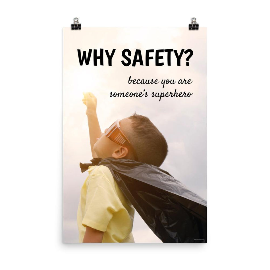 A workplace safety poster showing a young child with a makeshift cape and mask striking a superhero pose with the slogan why safety? because you are someone's superhero.