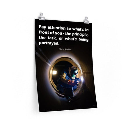Safety poster of a welder in safety gear and hood sitting inside a large pipe; they are welding with bright sparks flying and a safety quote in white text at the top.