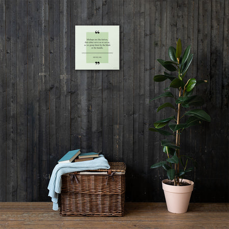 A safety poster with a green background with a quote by James Russell Lowell that says "Mishaps are like knives, that either serve us or cut us, as we grasp them by the blade or the handle."