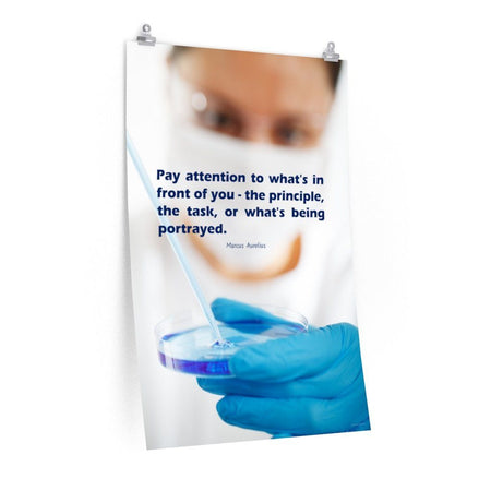 Safety poster showing a close up of a woman's face wearing safety glasses and a white face mask, holding a petri dish and pipette with a safety quote written in blue text.