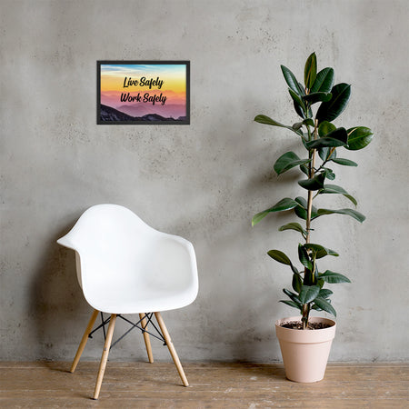 A safety poster showing a mountain range with a beautiful gradient in the sky of blue, yellow, and pink with the safety slogan "Live Safely Work Safely."