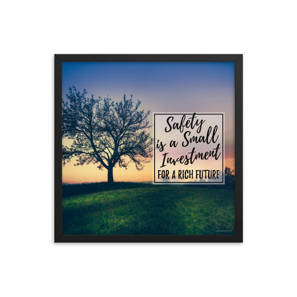 A workplace safety poster showing a lush green field at dusk with the silhouette of a huge tree and the slogan "Safety is a small investment for a rich future."