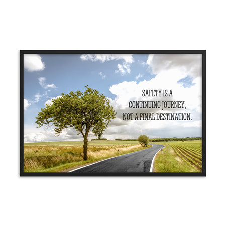 A workplace safety poster depicting a beautiful sunny day with a bright blue sky and a lush green field being cut down the middle by a road leading off into the countryside with the text safety is a continuing journey, not a final destination.
