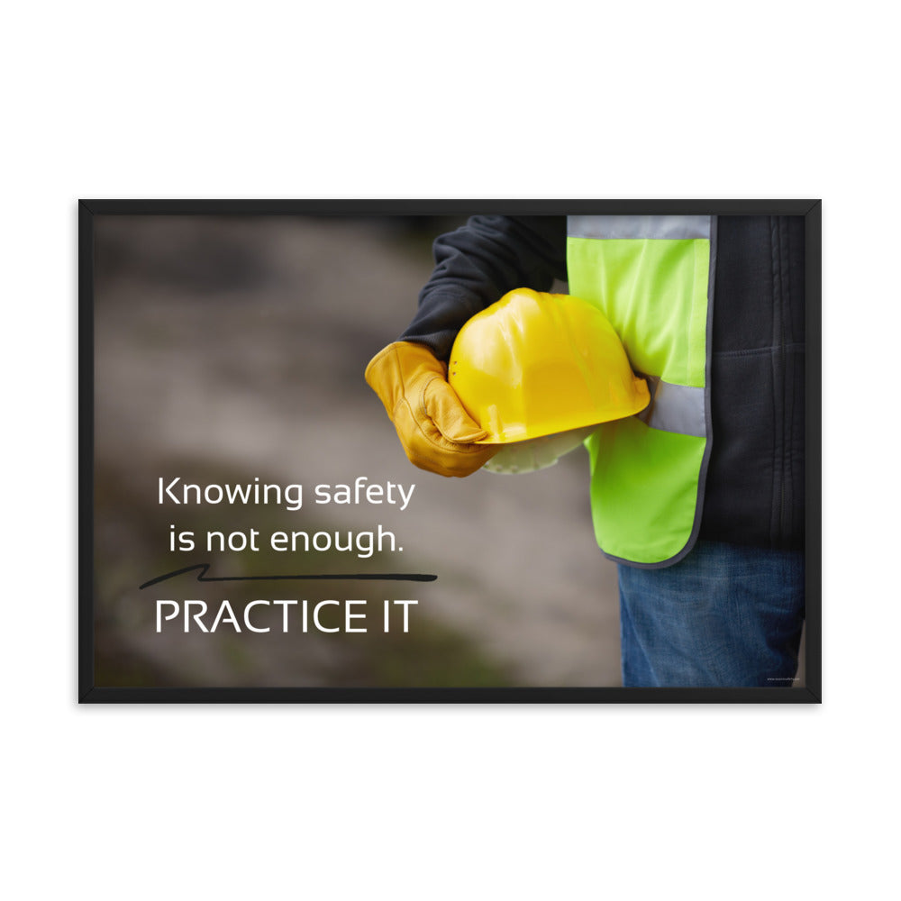 A safety poster showing a construction worker in a reflective vest and gloves holding a hard hat with the slogan "Knowing safety is not enough. Practice it."