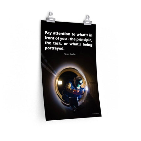 Safety poster of a welder in safety gear and hood sitting inside a large pipe; they are welding with bright sparks flying and a safety quote in white text at the top.