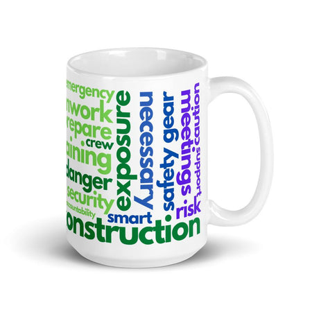 White ceramic mug with safety terms like hard hats, protection, and encourage, in a rainbow pattern across the mug.