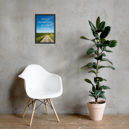 A workplace safety poster depicting a beautiful sunny day with a bright blue sky and a lush green field being cut down the middle by a dirt road leading off into the countryside with the text safety is a continuing journey, not a final destination.