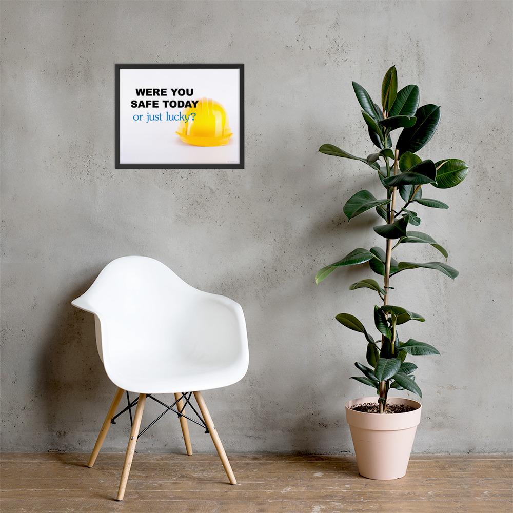 A workplace safety poster showing a yellow hard hat on a plain white background with the slogan were you safe today, or just lucky?
