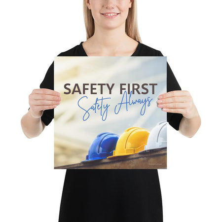 A workplace safety poster showing a white, a yellow, and a blue hardhat sitting on a wall with the slogan safety first, safety always.
