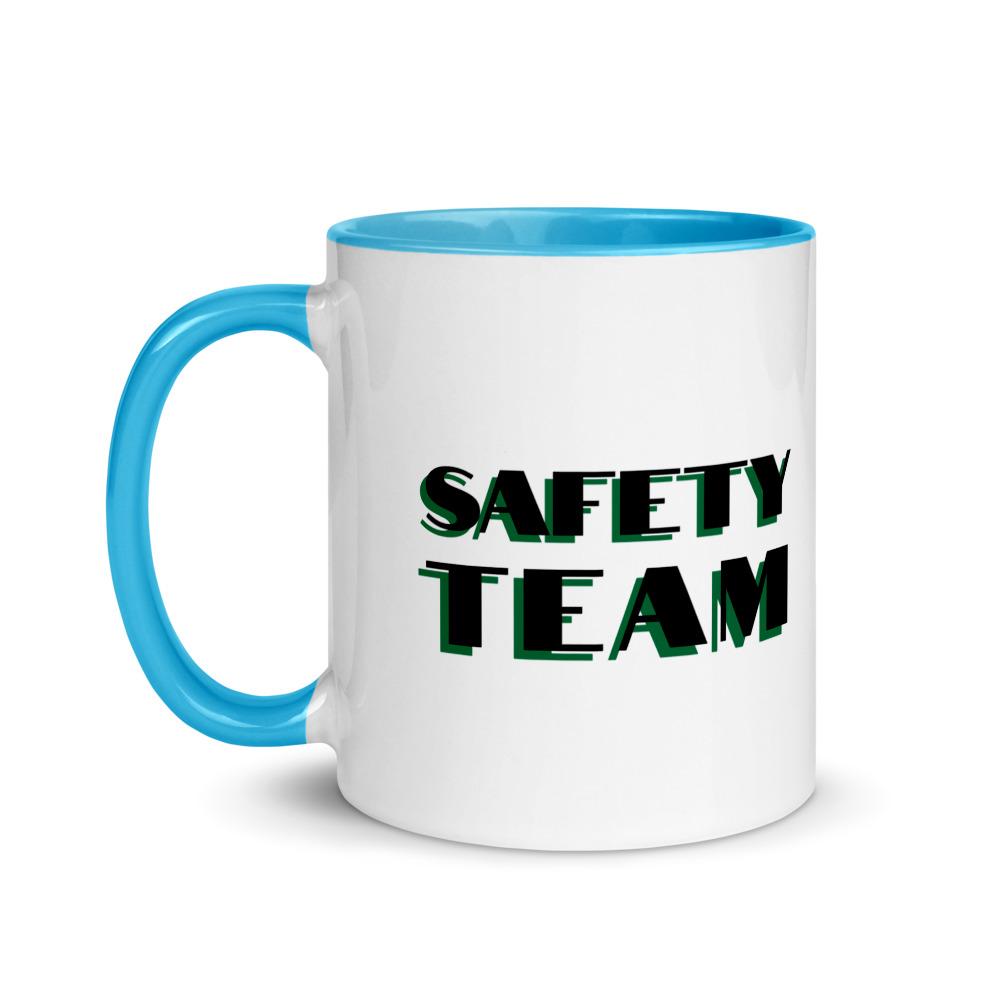 White ceramic mug with "Safety Team" in bold text across the side, with blue color on the inside, the rim, and the handle.