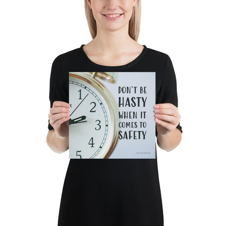 A workplace safety poster showing a close-up of a clock face with the slogan don't be hasty when it comes to safety.