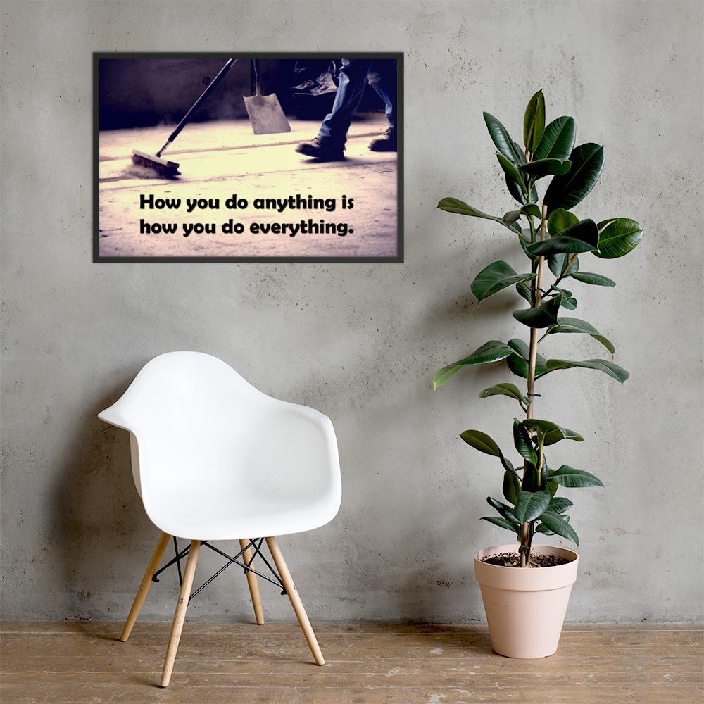Safety poster showing a closeup of the ground where a warehouse or construction worker is sweeping the workshop floor and an encouraging safety slogan written in bold text.