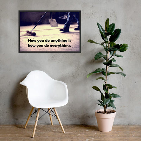 Safety poster showing a closeup of the ground where a warehouse or construction worker is sweeping the workshop floor and an encouraging safety slogan written in bold text.