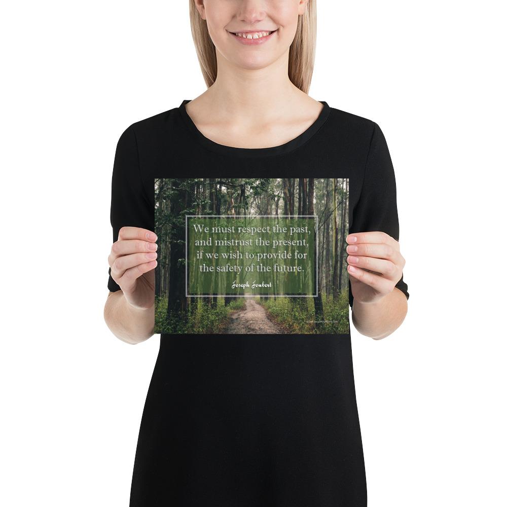A workplace safety poster of a lush green forest with a footpath cutting directly in the middle winding down the forest with the a safety quote by Joseph Joubert centered on the poster.