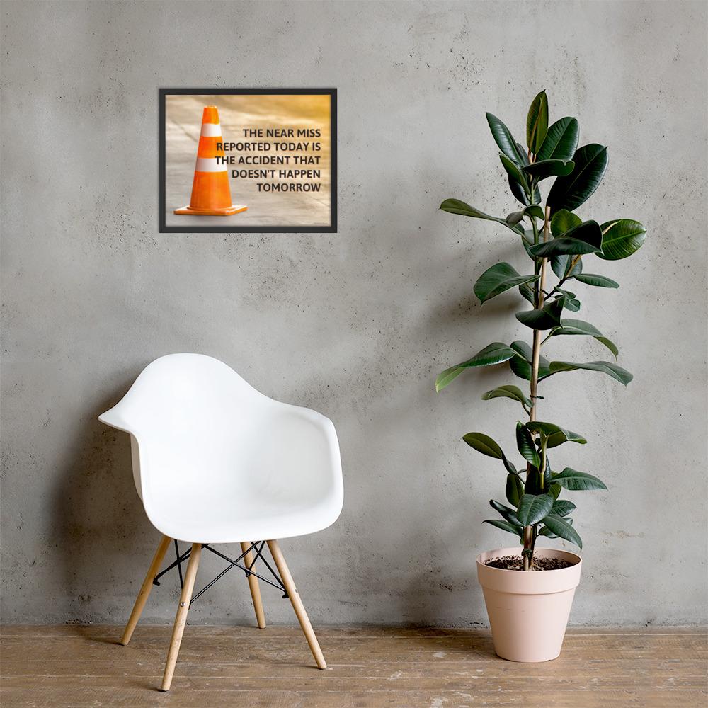 A workplace safety poster showing an orange safety cone with the slogan the near miss reported today is the accident that doesn't happen tomorrow.
