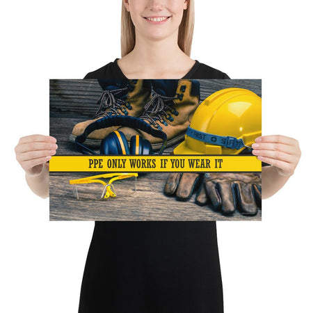 A safety poster showing a close-up of various PPE including safety glasses, ear muffs, gloves, a hard hat, and work boots with the slogan PPE only works if you wear it.