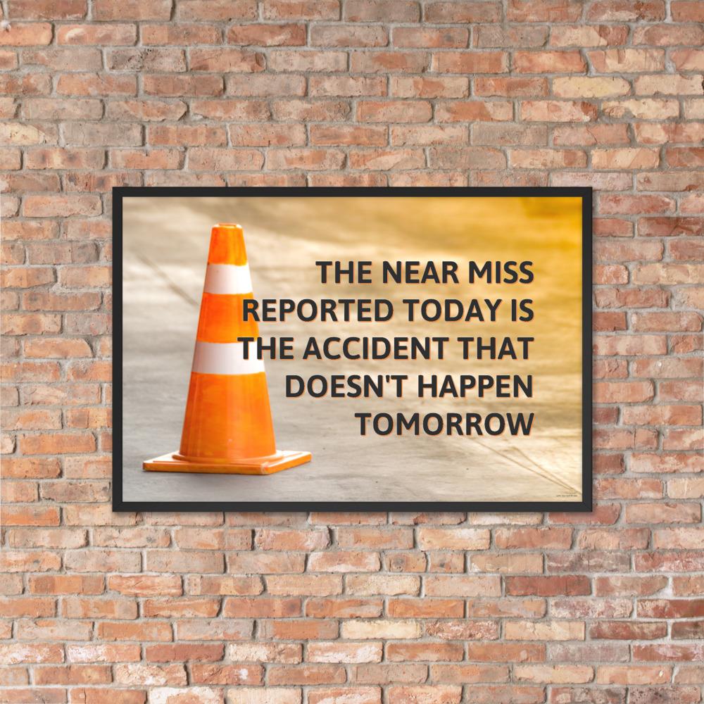 A workplace safety poster showing an orange safety cone with the slogan the near miss reported today is the accident that doesn't happen tomorrow.