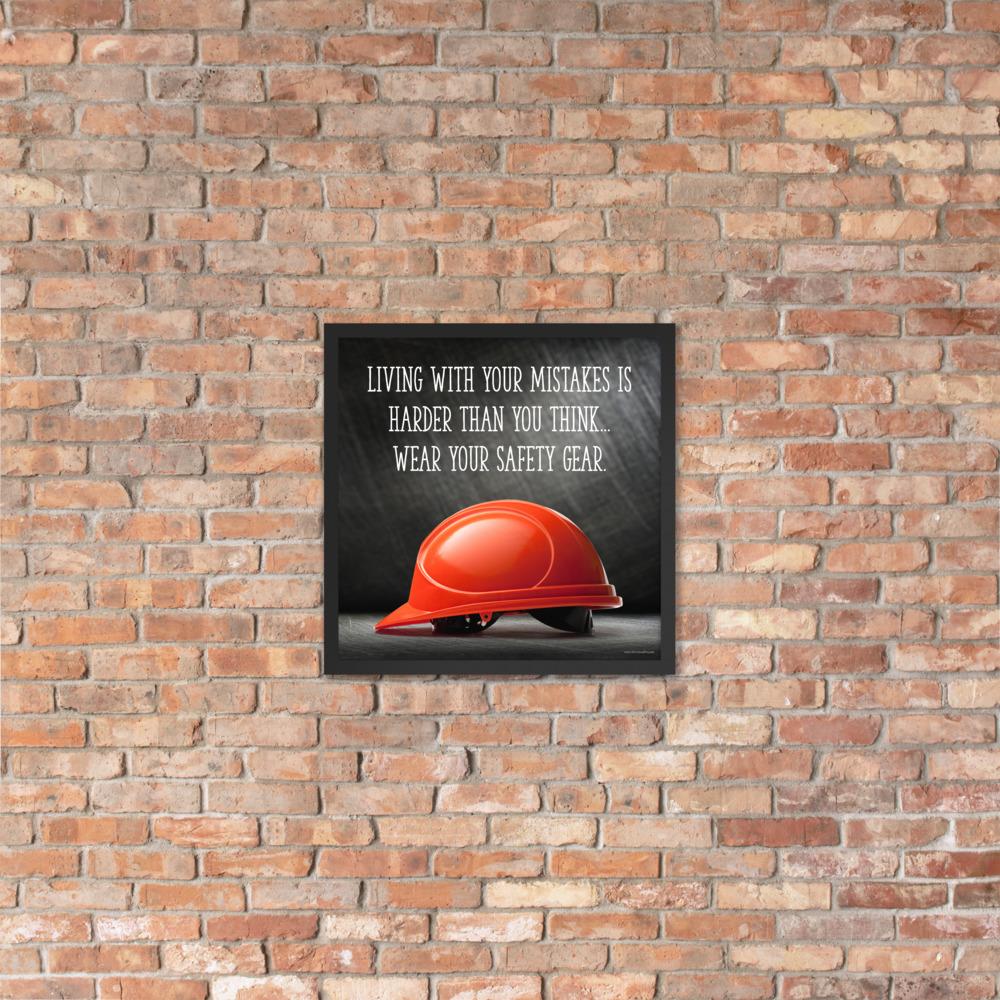 A workplace safety poster showing a bright red hard hat with an ominous black background with the slogan living with your mistakes is harder than you think, wear your safety gear.