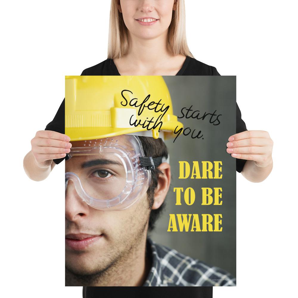 Safety poster showing a close up on half of a man's face wearing a yellow hard hat and safety glasses with text to the right.