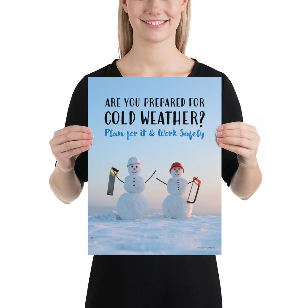 A safety poster showing two snowmen wearing hard hats and holding hand saws with the slogan are you prepared for cold weather? Plan for it and work safely.