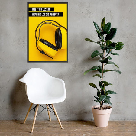 A hearing protection safety poster depicting bright yellow ear muffs on a bright yellow background in the bottom right corner with a bold safety slogan in the upper left corner.