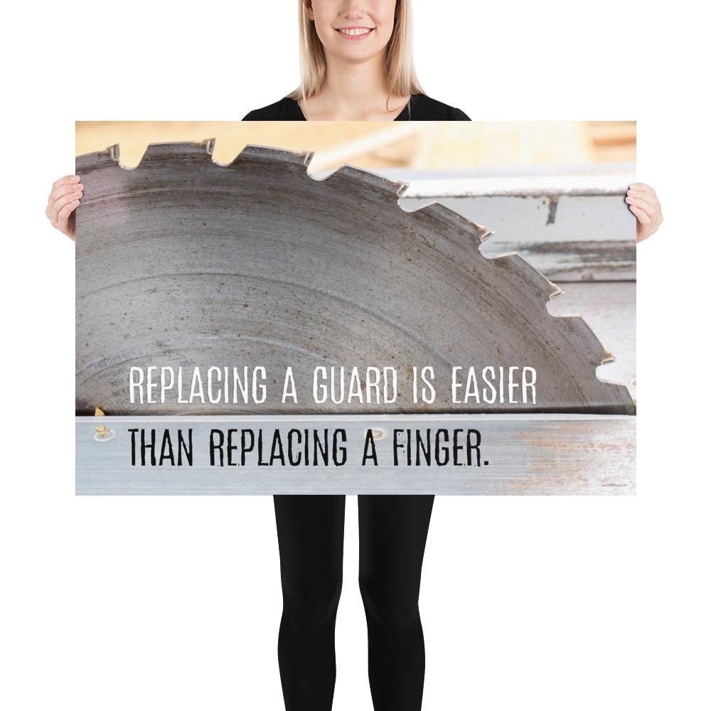 A workplace safety poster depicting a close up of a table saw blade in a workshop with a safety slogan on the bottom half of poster.