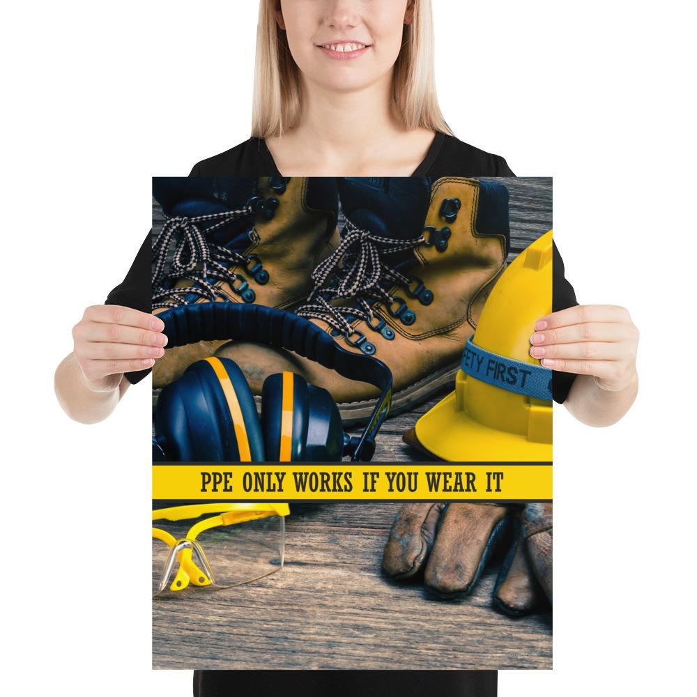 A safety poster showing a close-up of various PPE including safety glasses, ear muffs, gloves, a hard hat, and work boots with the slogan PPE only works if you wear it.