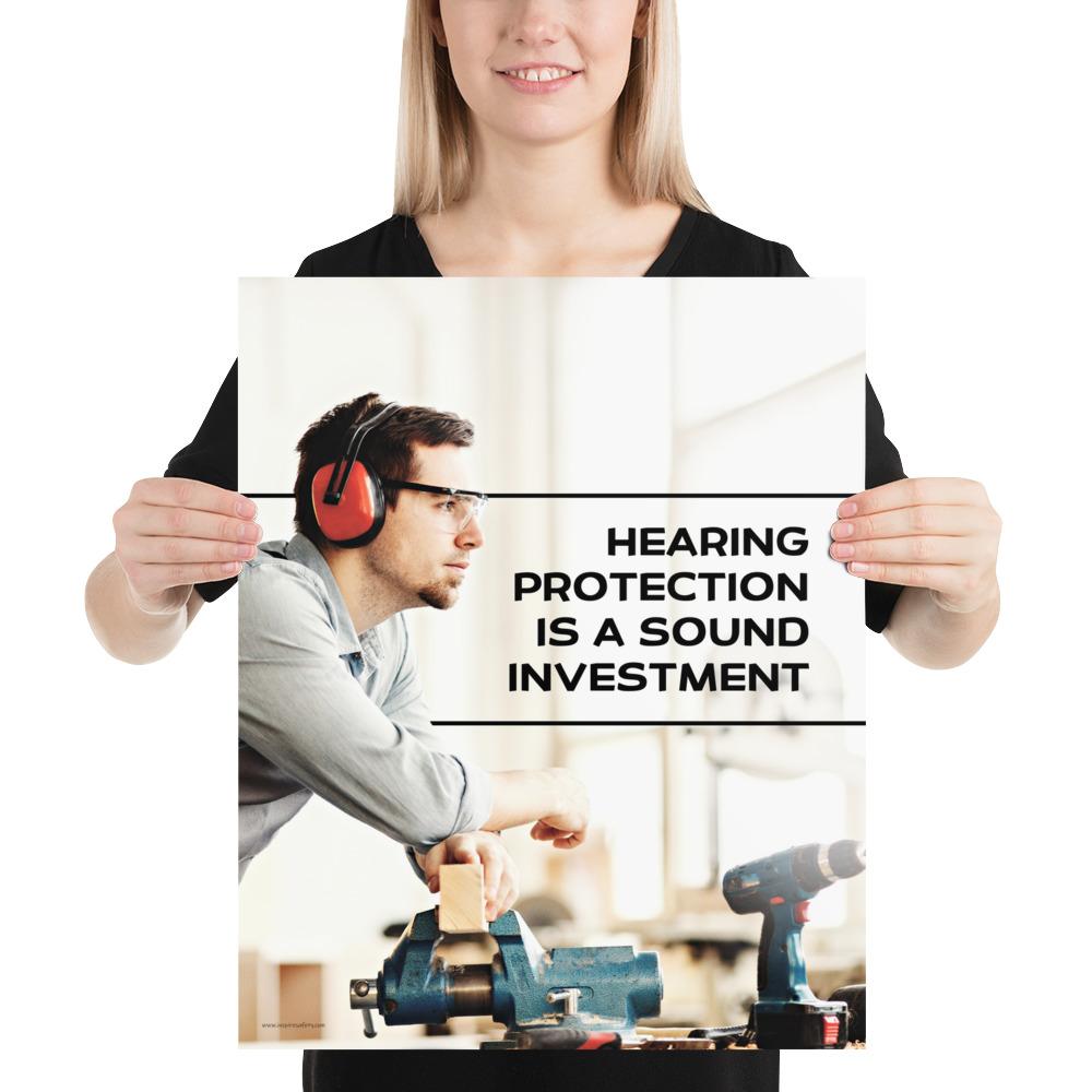 A workplace safety poster of a man in safety glasses and earmuffs taking a break in his woodshop with a safety slogan to the right.