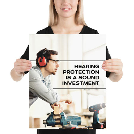 A workplace safety poster of a man in safety glasses and earmuffs taking a break in his woodshop with a safety slogan to the right.