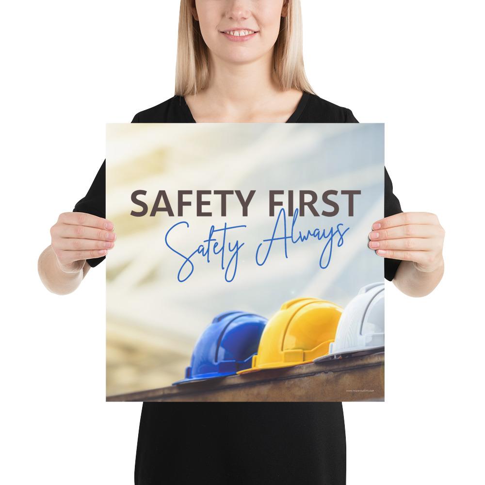 A workplace safety poster showing a white, a yellow, and a blue hardhat sitting on a wall with the slogan safety first, safety always.