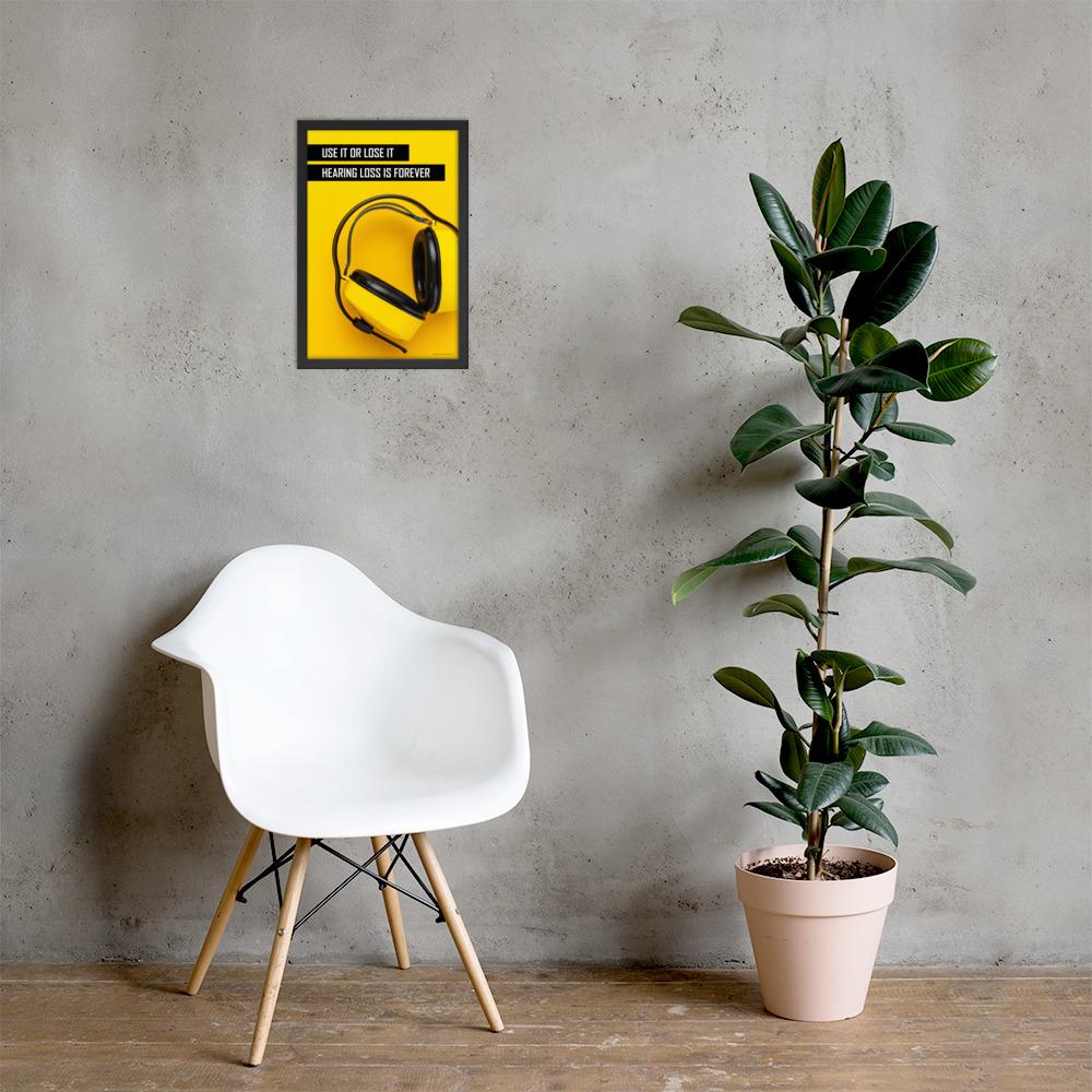 A hearing protection safety poster depicting bright yellow ear muffs on a bright yellow background in the bottom right corner with a bold safety slogan in the upper left corner.