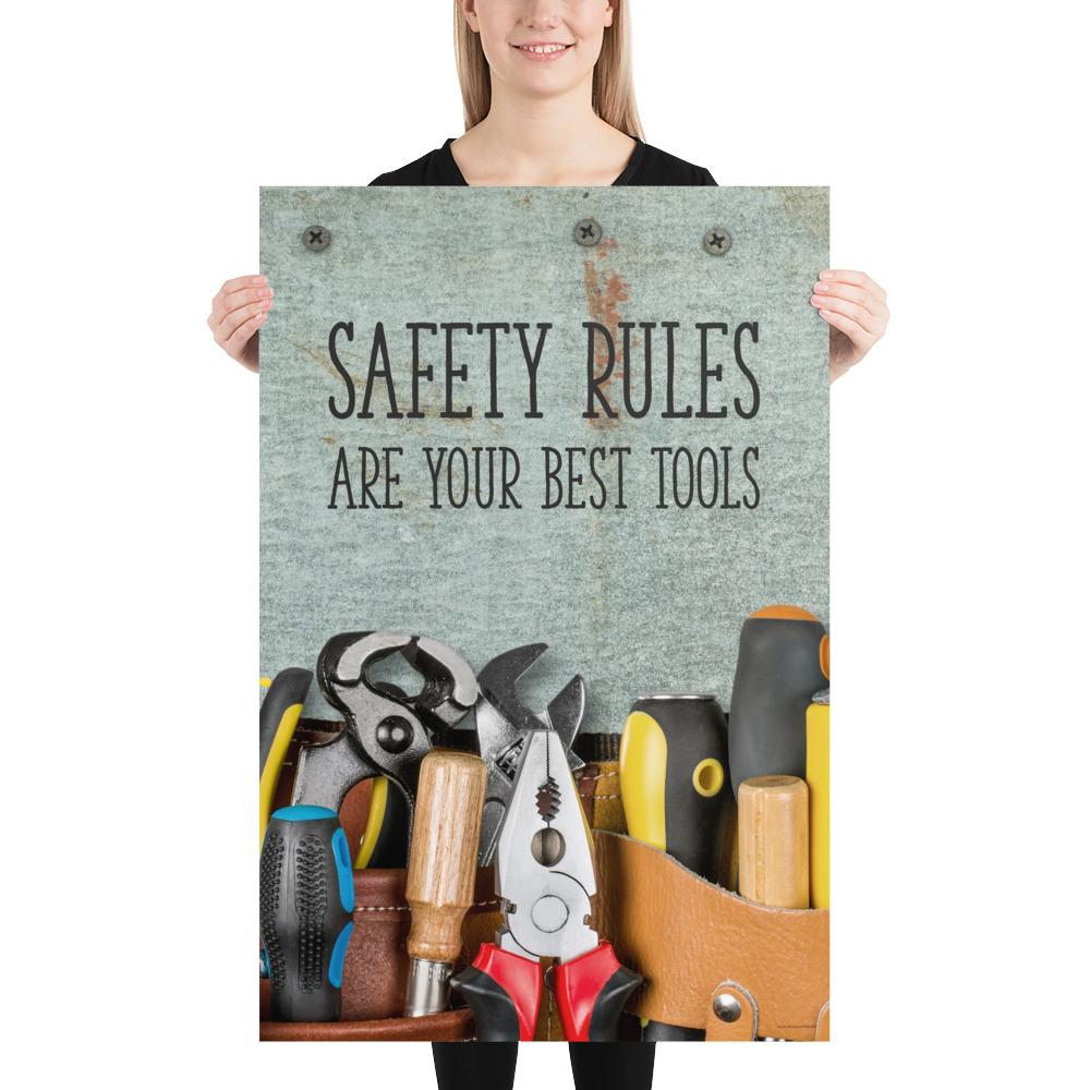 A safety poster showing various tools including screwdrivers, pliers, and wrenches laying on a worktable with the slogan safety rules are your best tools.