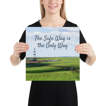A safety poster showing an oil rig in a beautiful landscape scene of a field with vivid green grass and a bright blue sky with the slogan the safe way is the only way.
