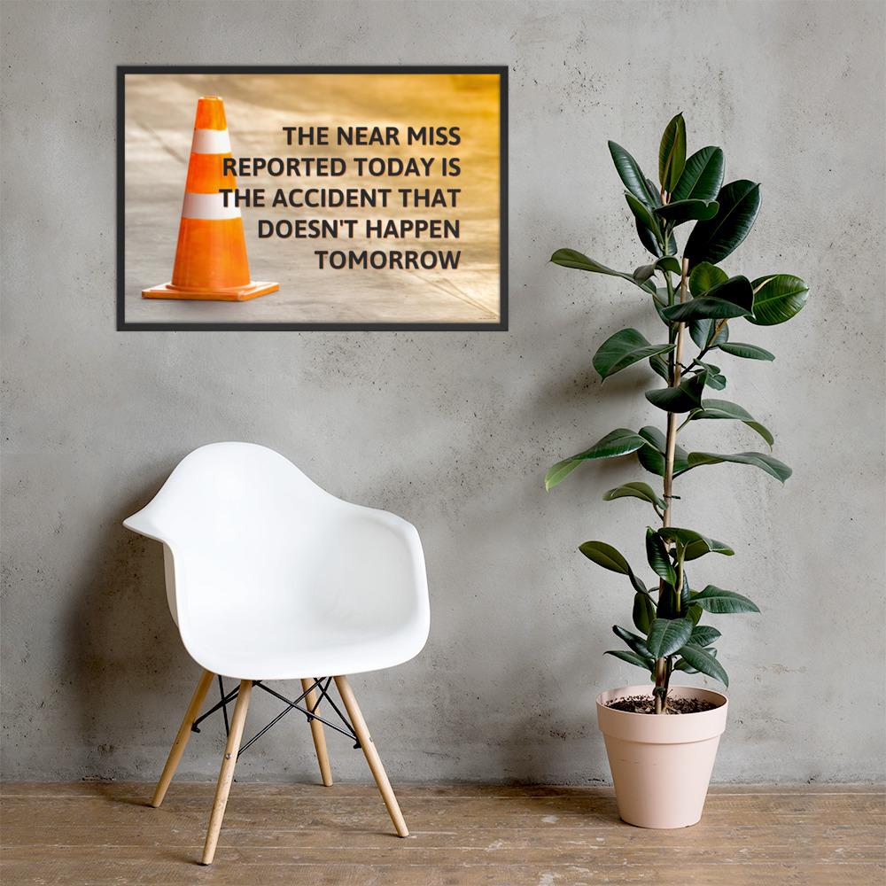 A workplace safety poster showing an orange safety cone with the slogan the near miss reported today is the accident that doesn't happen tomorrow.